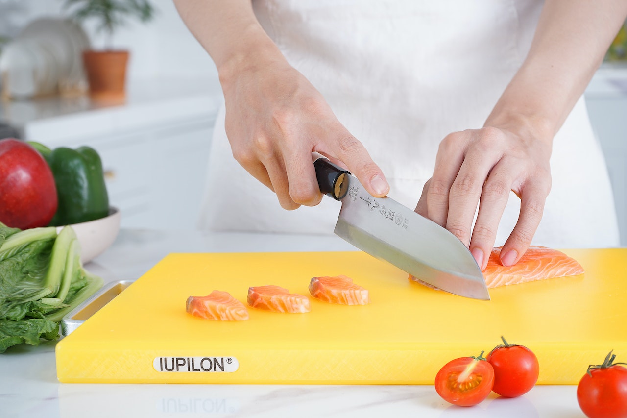 slicing salmon using miyabi knife