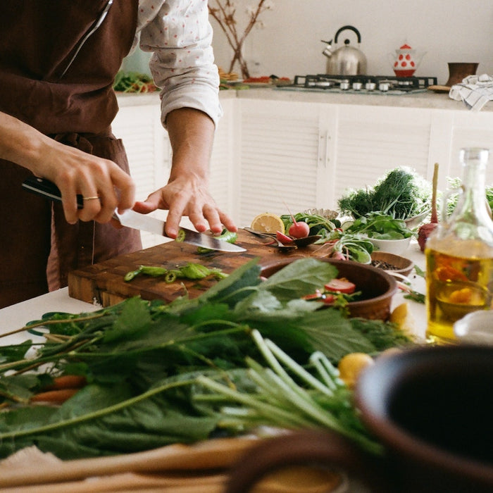 using chef's knife to chop vegetables