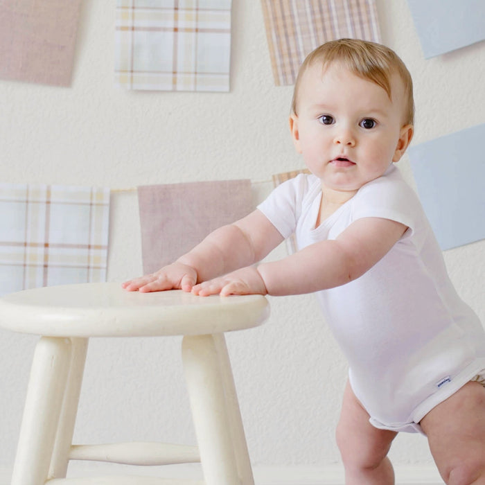 child holding onto stool